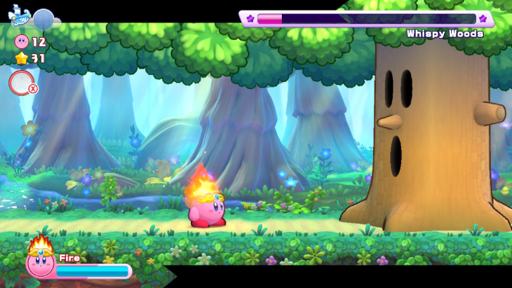 Fighting the iconic Whispy Woods boss in Kirby's Return to Dream Land Deluxe 