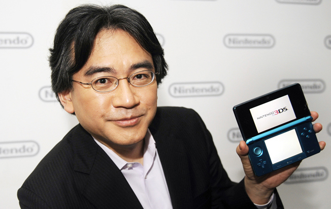 Satoru Iwata, President of Nintendo Co., Ltd., poses after Nintendo's E3 presentation of their new Nintendo 3DS at the E3 Media & Business Summit in Los Angeles